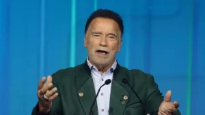 Actor Arnold Schwarzenegger says immigrants should behave like guests in America