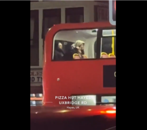 A randy couple who couldn't wait to get home to celebrate the New Year were filmed 'having s£x' on the top deck of a moving bus.