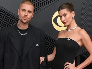Singer Justin and wife Hailey Bieber wear 'ICE Out' pins to Grammys